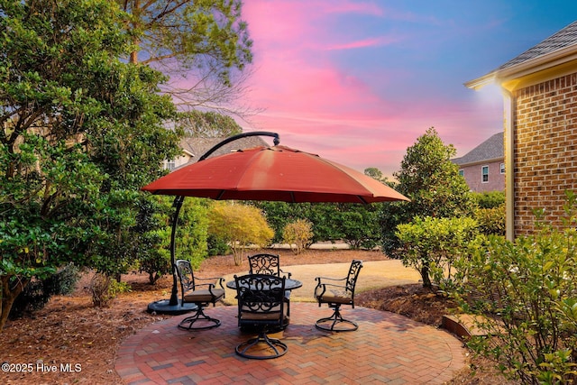 view of patio terrace at dusk