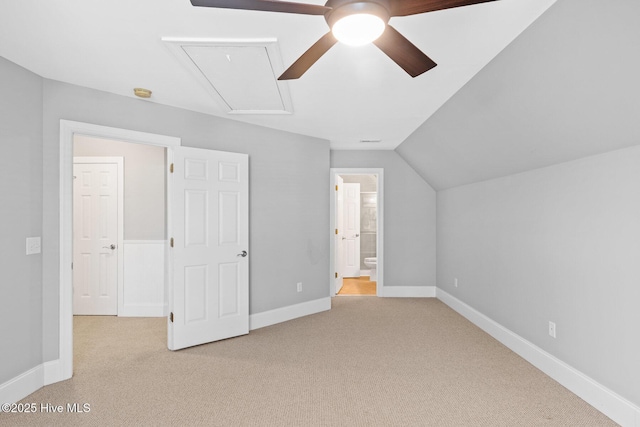 additional living space with lofted ceiling, light carpet, and ceiling fan