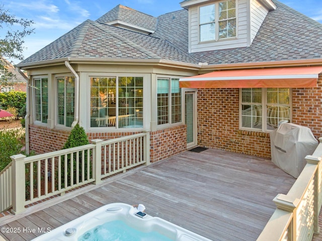 wooden deck featuring grilling area