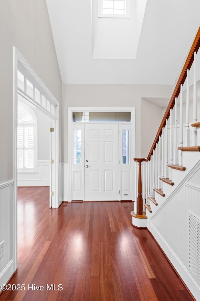 foyer featuring a wealth of natural light and wood-type flooring