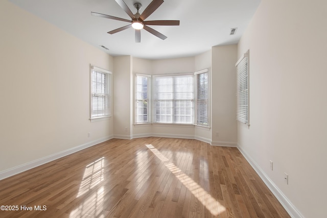 spare room with ceiling fan and light hardwood / wood-style flooring