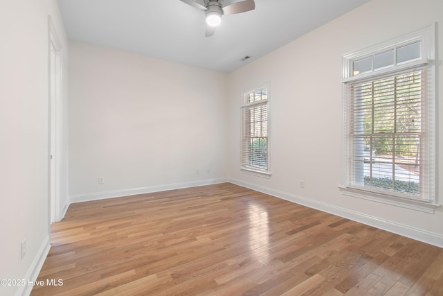 unfurnished room featuring ceiling fan and light hardwood / wood-style flooring