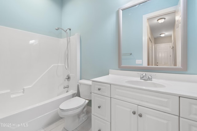 full bathroom with tile patterned flooring, shower / washtub combination, vanity, and toilet