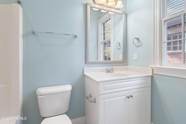 bathroom featuring vanity and toilet