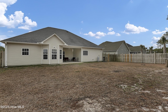 rear view of property featuring a patio