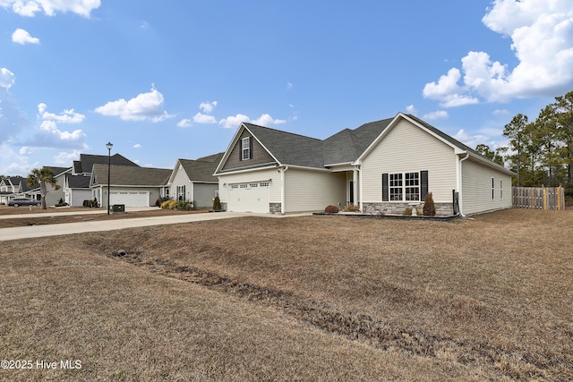 view of front of property featuring a garage and a front yard