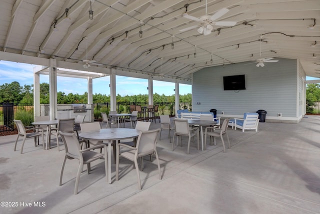 view of patio with exterior kitchen and ceiling fan