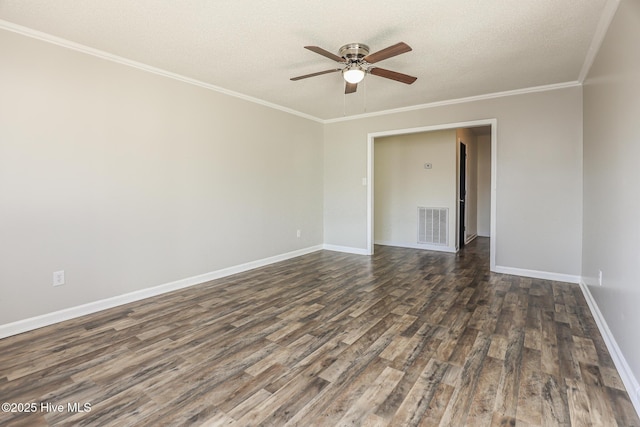 empty room featuring crown molding, dark wood-type flooring, a textured ceiling, and ceiling fan