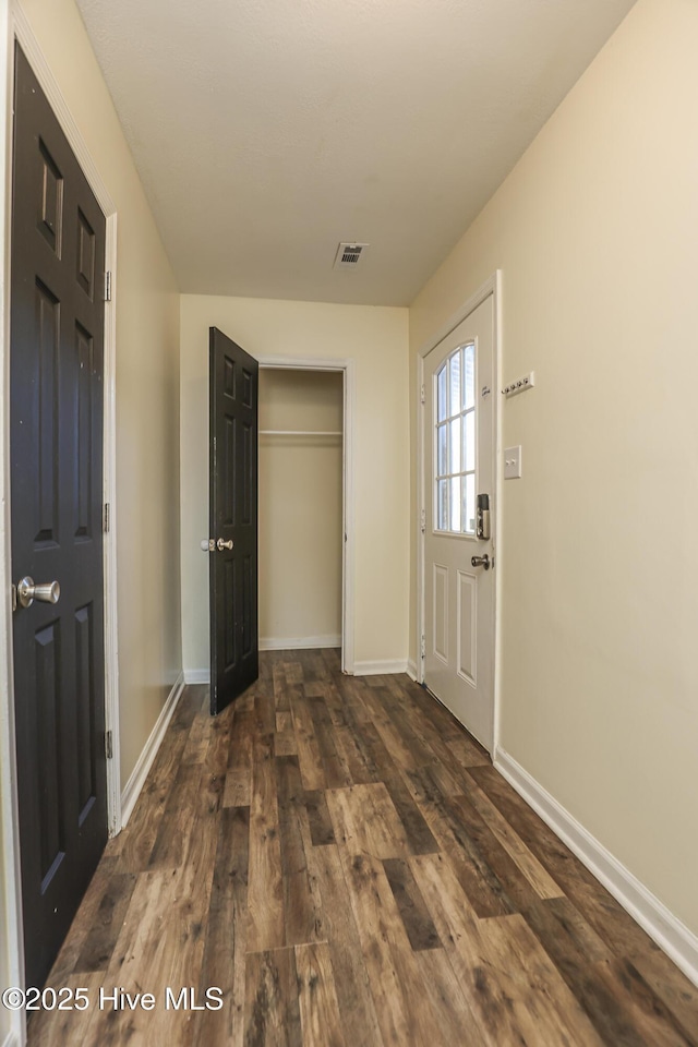 entrance foyer with dark hardwood / wood-style flooring