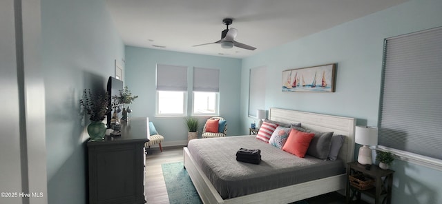 bedroom featuring hardwood / wood-style flooring and ceiling fan