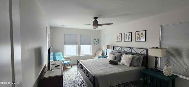 bedroom featuring hardwood / wood-style flooring and ceiling fan