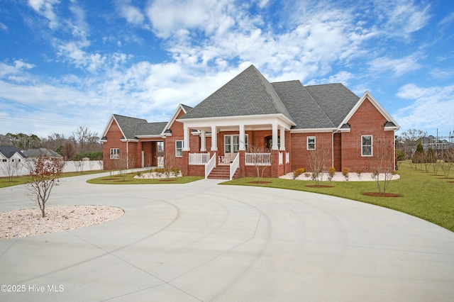 view of front facade with a front lawn and a porch