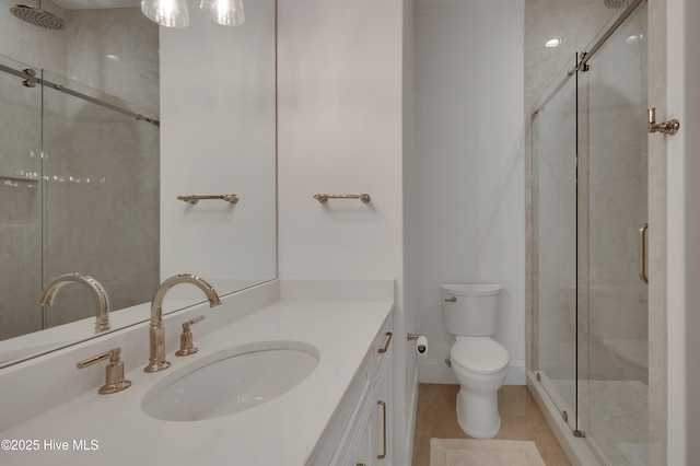 bathroom with vanity, toilet, and walk in shower