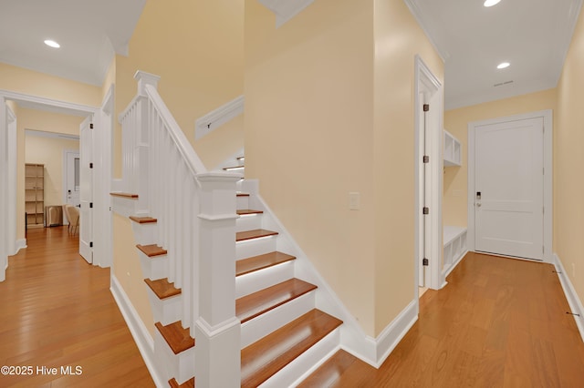 stairway featuring hardwood / wood-style floors