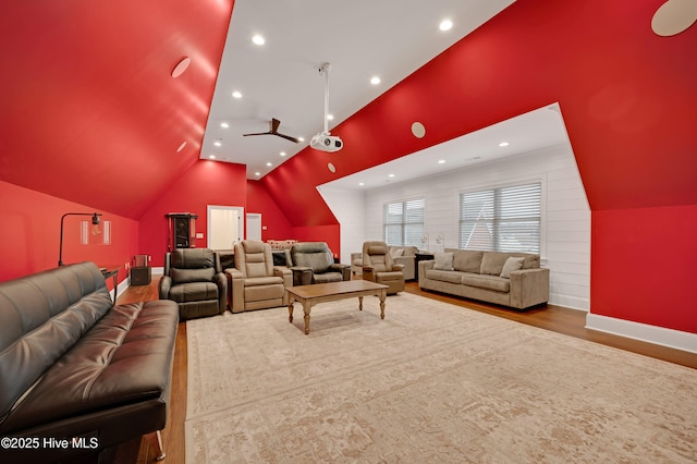 cinema featuring wood-type flooring, vaulted ceiling, and ceiling fan