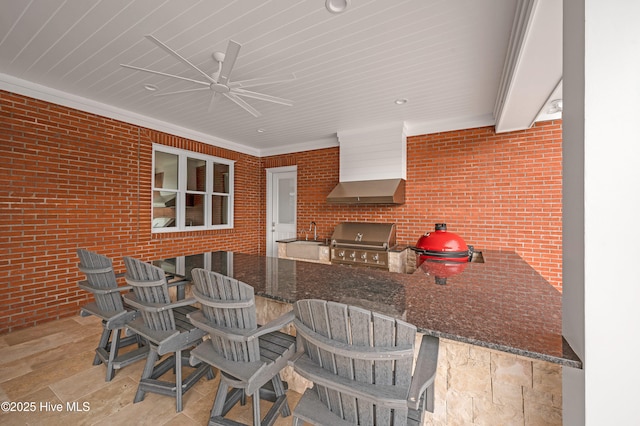 view of patio / terrace with exterior kitchen, exterior bar, area for grilling, and ceiling fan