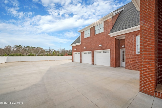 view of property exterior featuring a garage