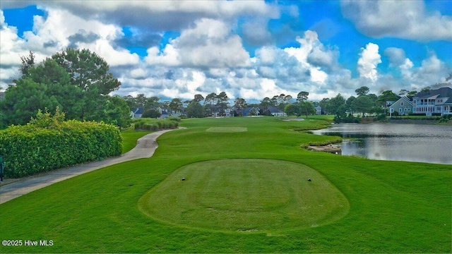 view of home's community featuring view of golf course and a water view