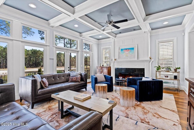 sunroom with french doors, coffered ceiling, and beamed ceiling