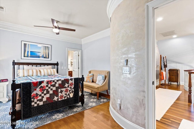 4174 Brookfield Way, Southport, NC 28461 - bedroom featuring wood finished floors, crown molding, connected bathroom, and a ceiling fan