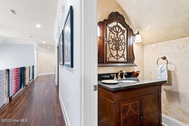 4174 Brookfield Way, Southport, NC 28461 - corridor with a sink, dark wood finished floors, baseboards, ornamental molding, and recessed lighting