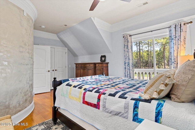 bedroom featuring crown molding, ceiling fan, access to exterior, wood finished floors, and visible vents