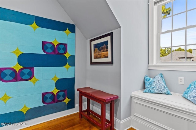 rec room with dark wood-style flooring, baseboards, and vaulted ceiling