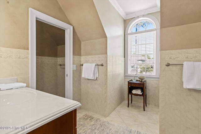 4174 Brookfield Way, Southport, NC 28461 - full bathroom with tile walls, tile patterned flooring, a walk in shower, vanity, and crown molding