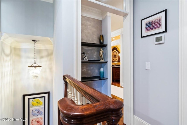 4174 Brookfield Way, Southport, NC 28461 - staircase with ornamental molding and a chandelier