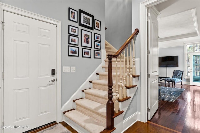 4174 Brookfield Way, Southport, NC 28461 - staircase featuring hardwood / wood-style flooring, baseboards, and ornamental molding