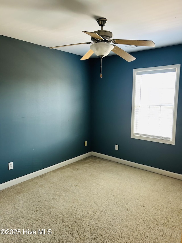 unfurnished room featuring carpet floors and ceiling fan