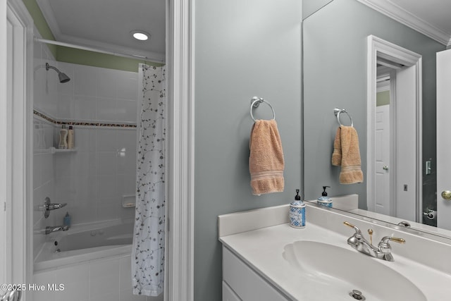 bathroom featuring shower / tub combo with curtain, ornamental molding, and vanity