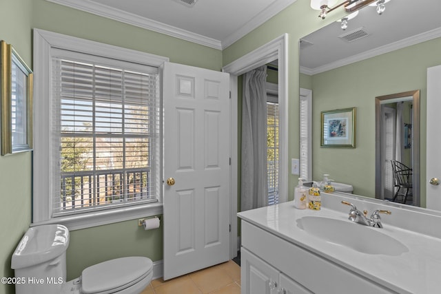 bathroom featuring crown molding, vanity, toilet, and tile patterned flooring