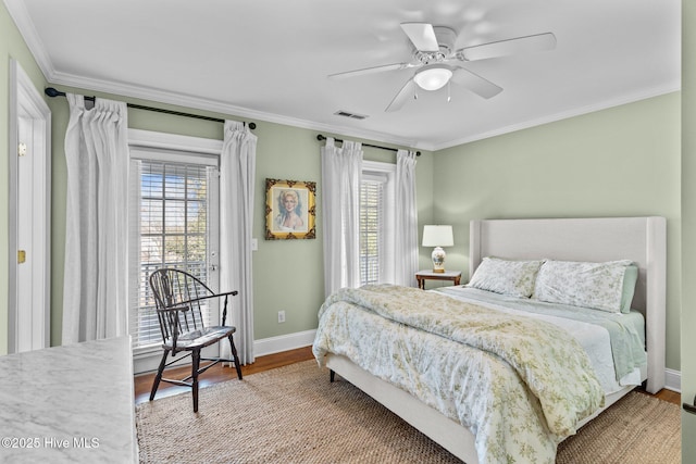 bedroom featuring crown molding, wood-type flooring, multiple windows, and access to outside