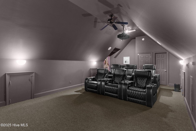 home theater room featuring vaulted ceiling, ceiling fan, and carpet