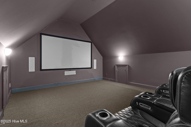 home theater with vaulted ceiling and carpet