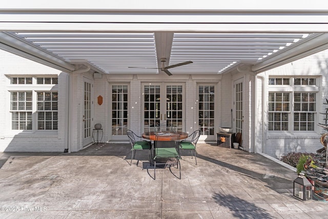 view of patio with ceiling fan and a pergola