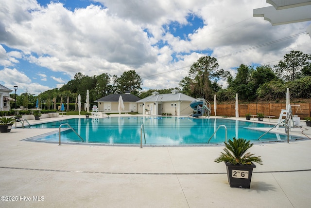 view of swimming pool featuring a patio area