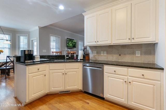 kitchen featuring sink, white cabinetry, light hardwood / wood-style flooring, dishwasher, and kitchen peninsula