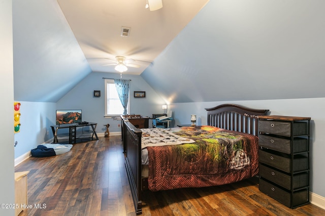 bedroom featuring ceiling fan, dark hardwood / wood-style floors, and vaulted ceiling