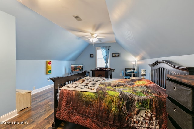 bedroom with vaulted ceiling, ceiling fan, and dark hardwood / wood-style flooring