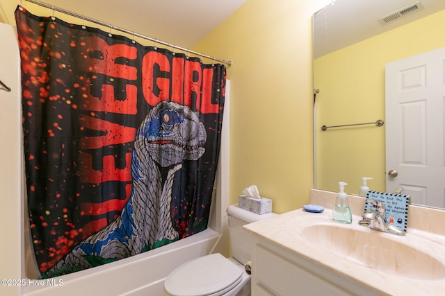 full bathroom featuring vanity, shower / bath combo, and toilet