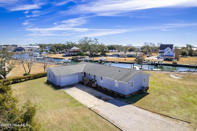 bird's eye view featuring a water view and a residential view