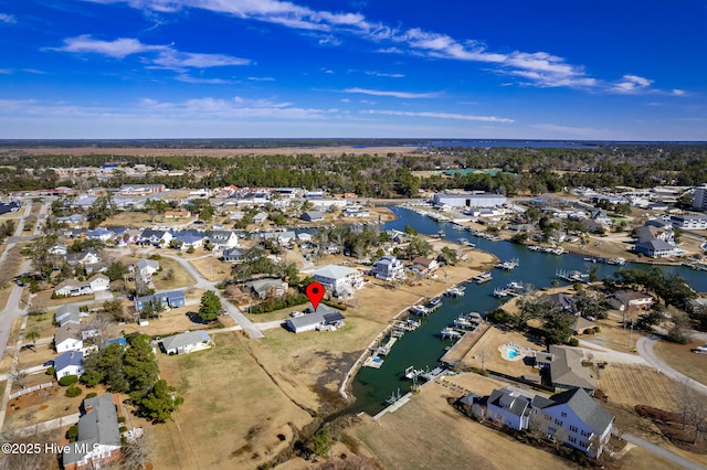 birds eye view of property featuring a water view and a residential view