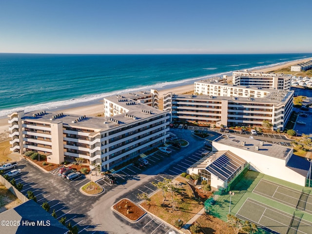 aerial view featuring a water view and a view of the beach