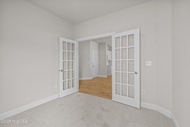 1200 Calabash Station Blvd NW, Calabash, NC 28467 - carpeted empty room featuring french doors and baseboards