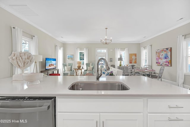 kitchen featuring white cabinetry, plenty of natural light, sink, and stainless steel dishwasher