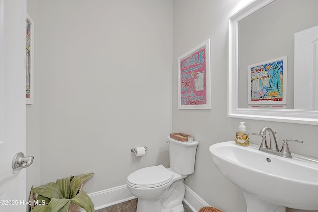 bathroom featuring sink and toilet