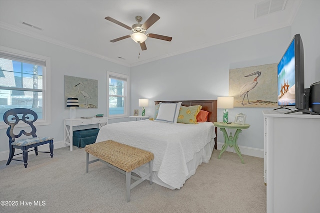 carpeted bedroom with crown molding and ceiling fan