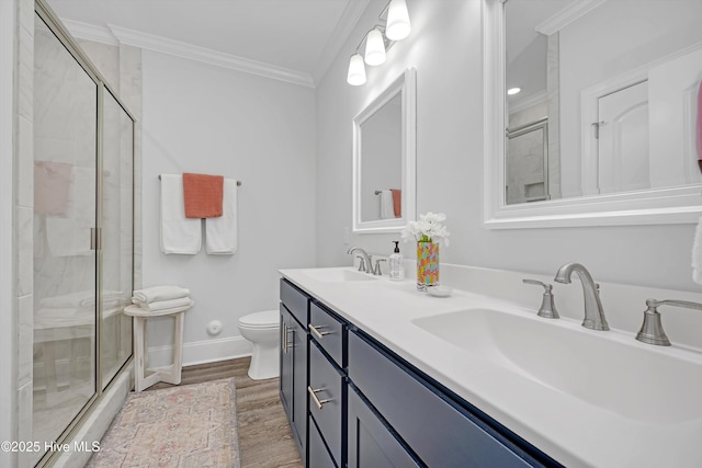 bathroom featuring a shower with door, ornamental molding, and hardwood / wood-style floors